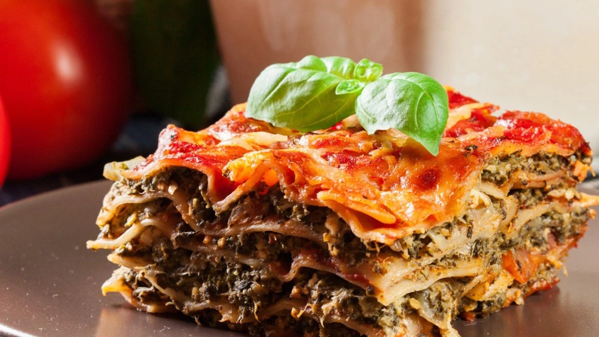 Vegetarian lasagna layered with fresh vegetables, ricotta cheese, and marinara sauce.