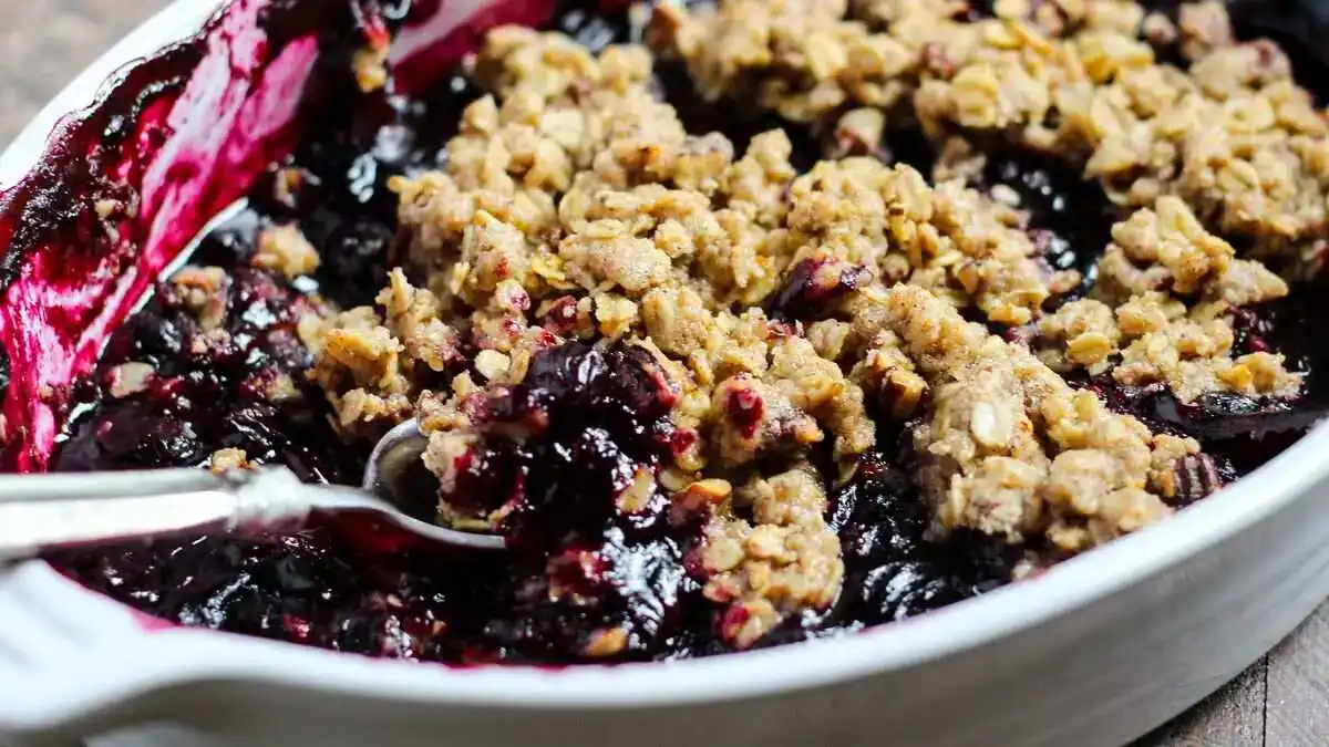 Delicious blueberry crisp topped with a crunchy oat mixture, served in a baking dish