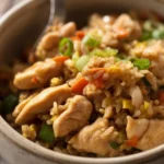 Delicious homemade chicken fried rice with chicken, vegetables, and eggs in one skillet.