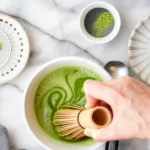 Ceremonial grade matcha green tea powder from Japan in vibrant green color.